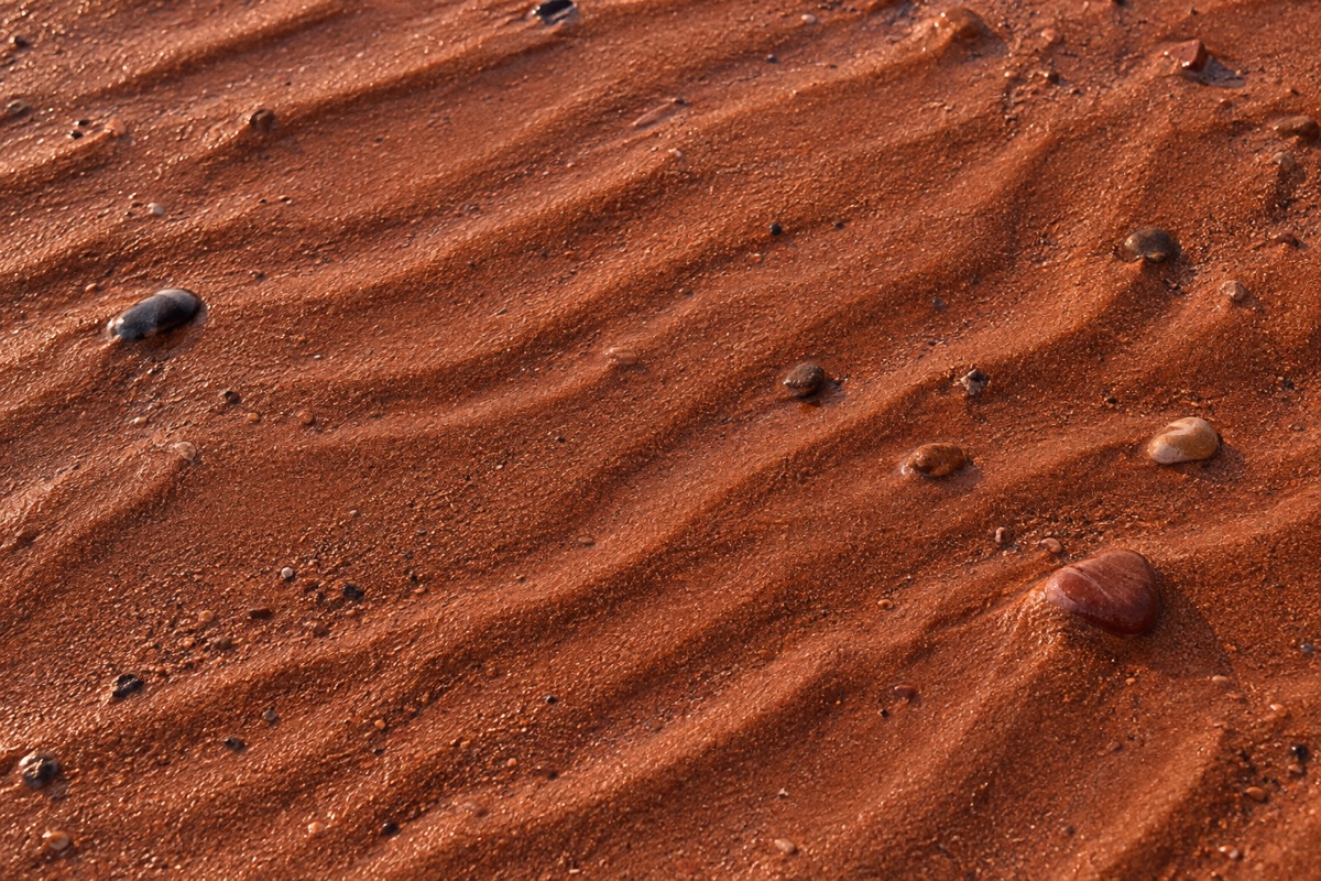 Red sand beach texture on Prince Edward Island